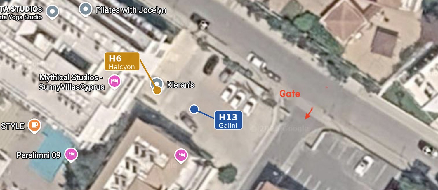Aerial view showing the resort gate on Georgiou Drosini and the car park just inside